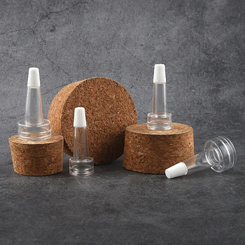 10db / tétel Mini újratölthető palackok minta üres palack kupakkal, trombitafejjel átlátszó portöltő palack Bőrápoló eszközök